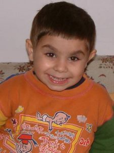 A young boy smiling