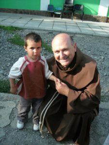 Father Paul with one of the children